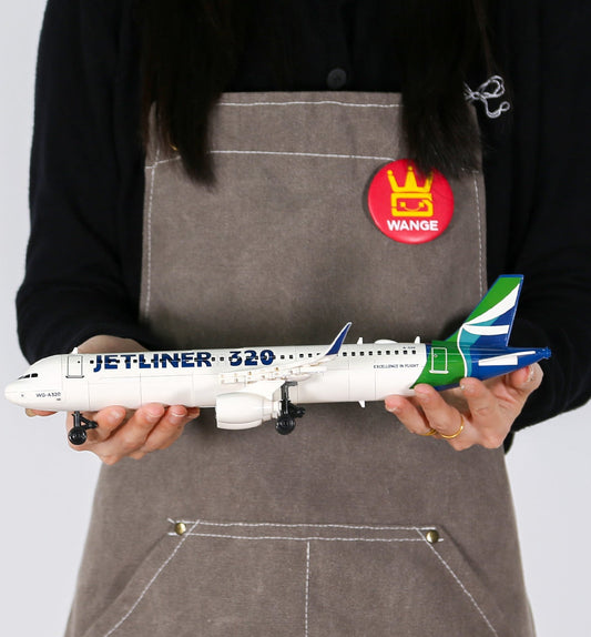 Person holding a model airplane with a visible brand logo on an apron.