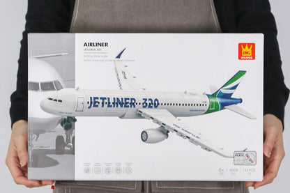 Person holding a model airplane box with branding on an apron