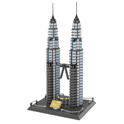 Side angle of Petronas Twin Towers brick model showing tiered setback design and skybridge detail