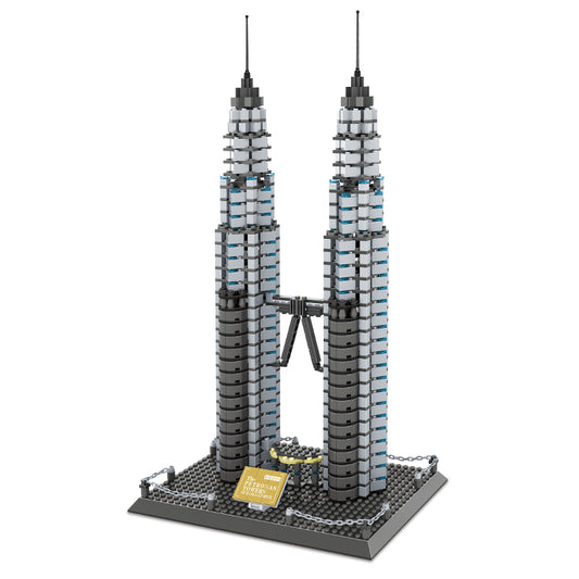 Side angle of Petronas Twin Towers brick model showing tiered setback design and skybridge detail