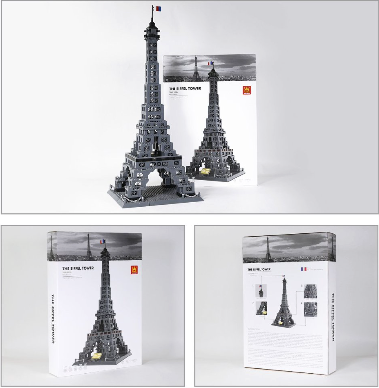 Model of the Eiffel Tower made from building blocks with packaging on a white background