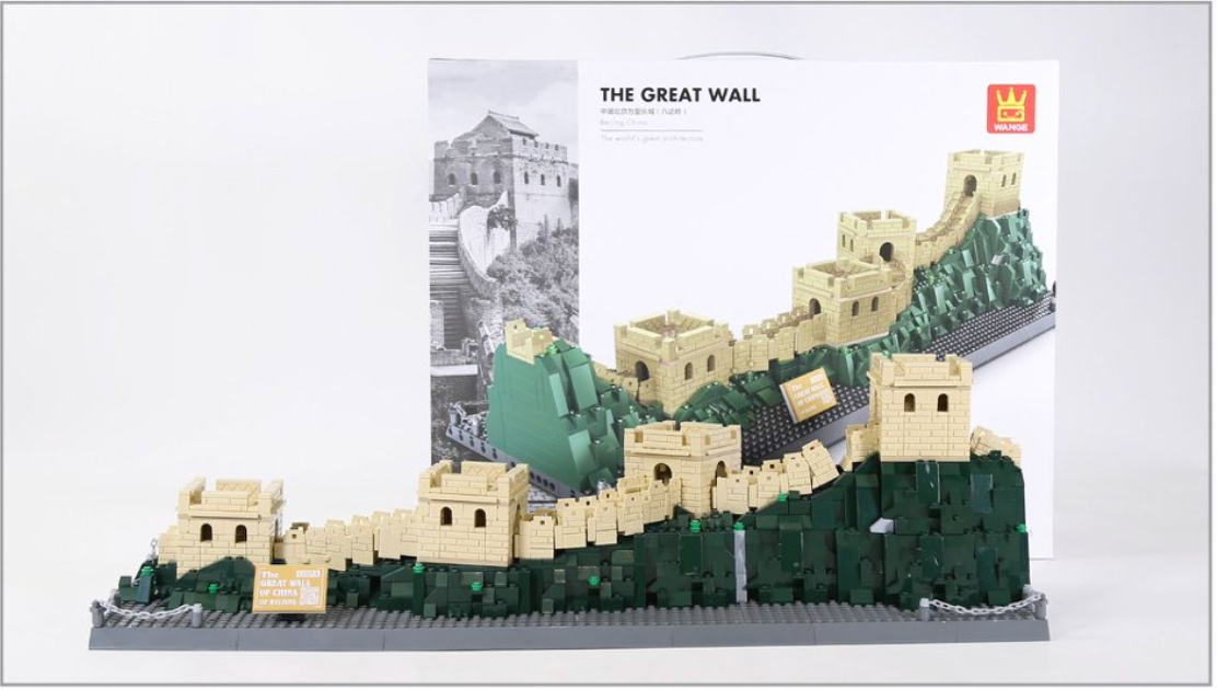 Model of the Great Wall of China made from building blocks with packaging in the background.