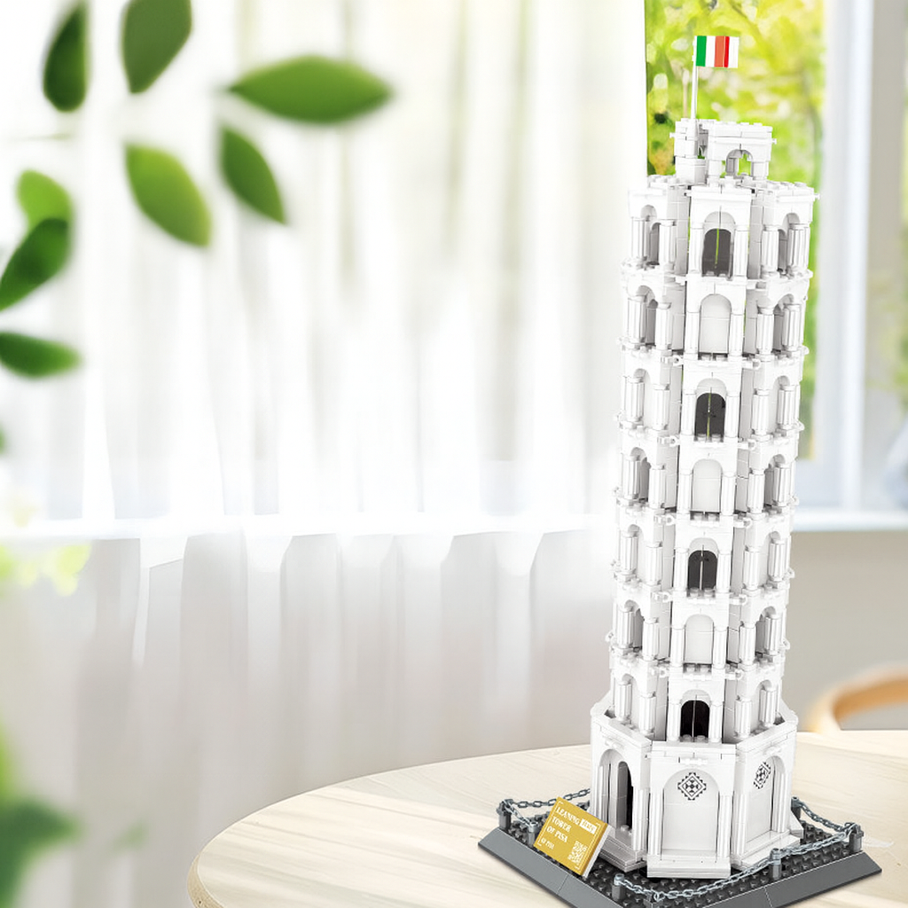 Model of the Leaning Tower of Pisa on a table with a blurred indoor background