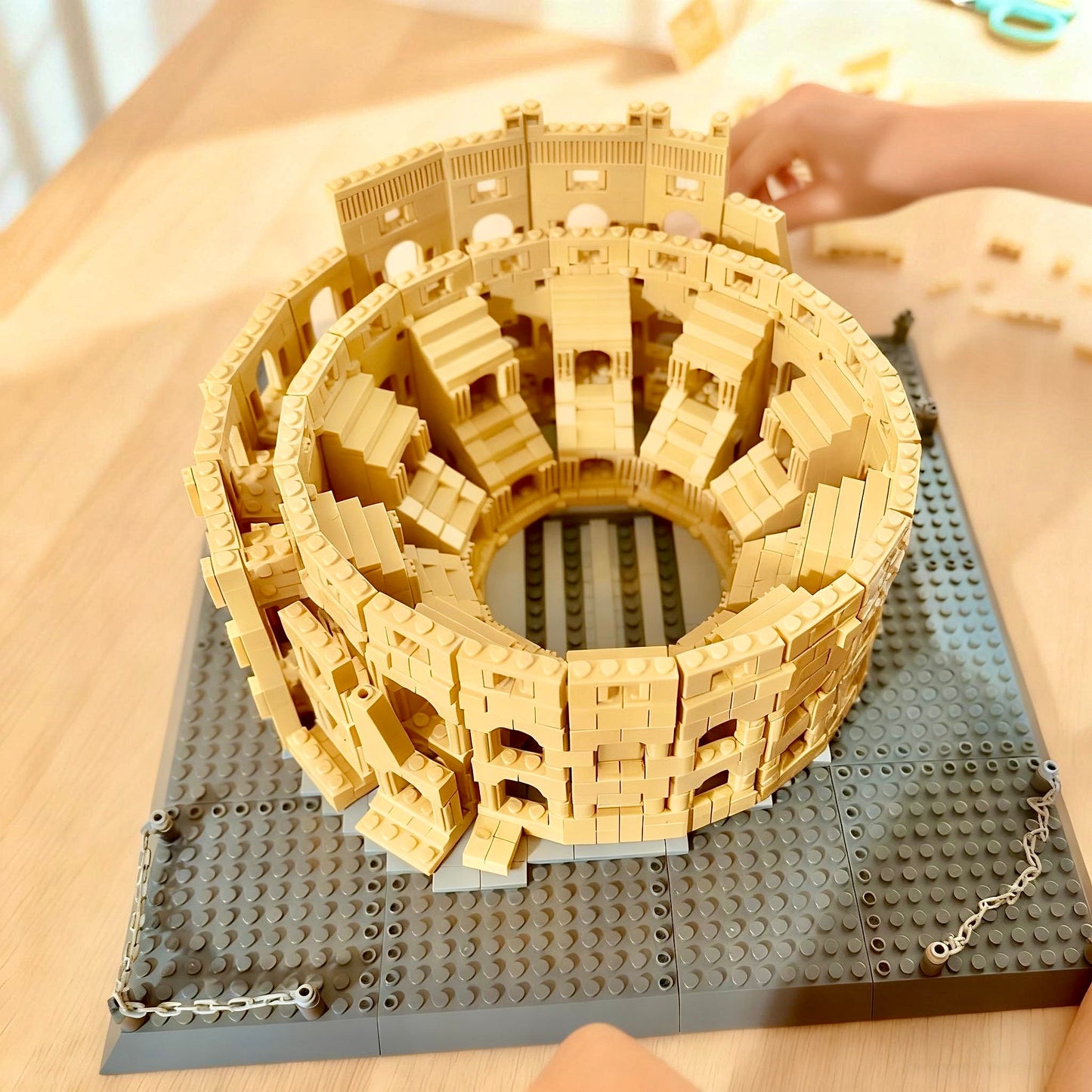 Assembled Colosseum Rome brick building set front view showing tiered arches and oval shape by Wondalands